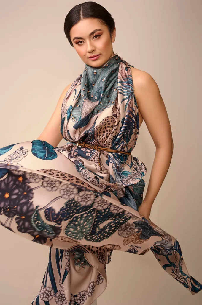 Model wearing Ilona Tambor Jungle Dream silk scarf with leopard peacock and jungle motifs