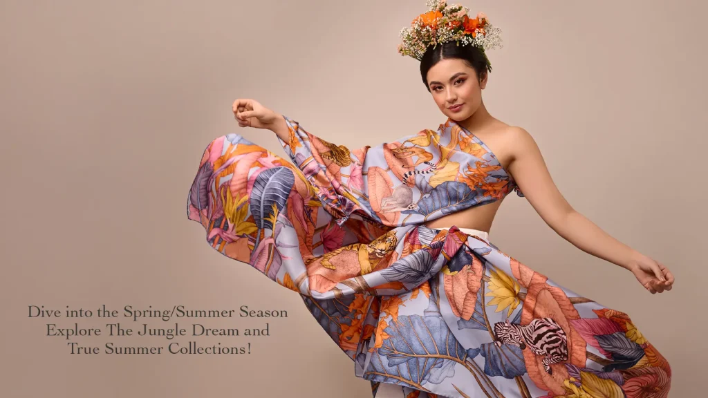 Model wearing Ilona Tambor Spring Summer 2024 silk scarf featuring the True Summer design with vibrant tropical illustration