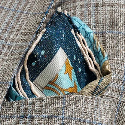 Il Carnevale di Venezia Blue Silk Pocket Square folded in pocket — deep blue and gold tones, handmade in Italy.