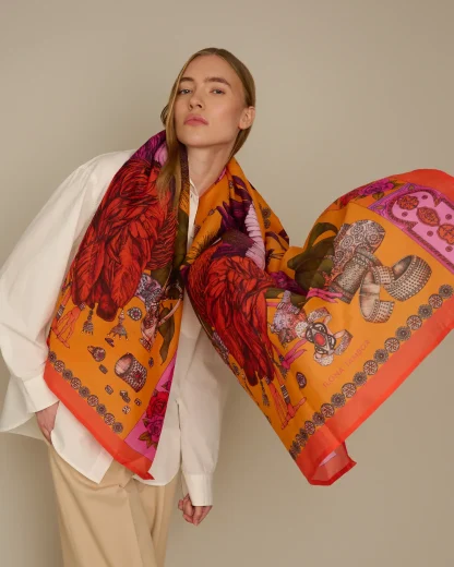 Model wearing an Ilona Tambor hand-illustrated cotton silk scarf